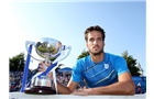 EASTBOURNE, ENGLAND - JUNE 21:  Feliciano Lopez of Spain celebrates with the trophy after beating Richard Gasquet of France during their Men's Singles Finals match on day eight of the Aegon International at Devonshire Park on June 21, 2014 in Eastbourne, England. (Photo by Jan Kruger/Getty Images)